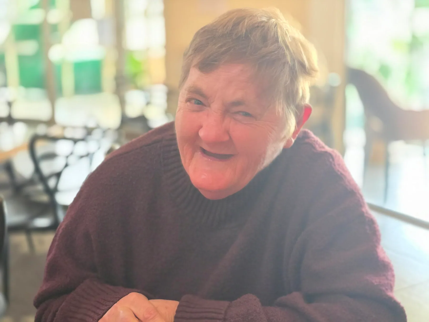 A participant smiling during a planning conversation