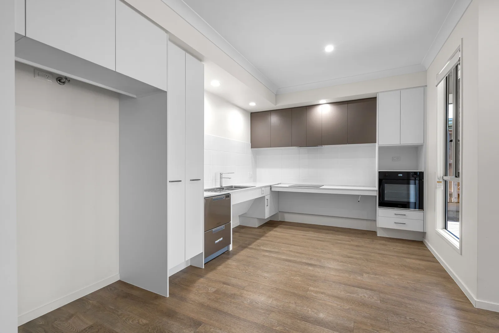 Kitchen with a low-set bench and wall oven