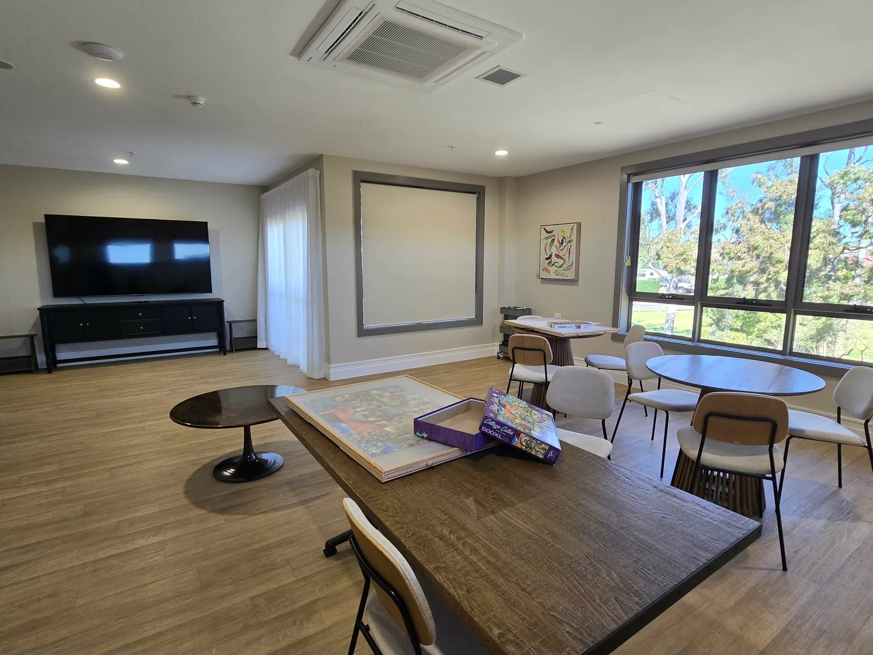 Shared community lounge with generous circulation space